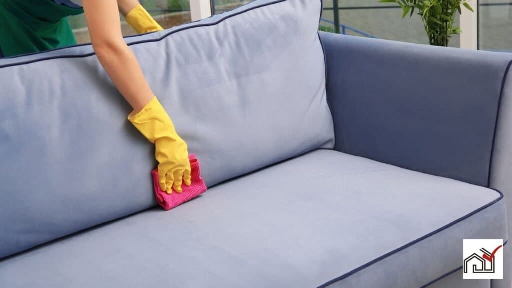 Woman cleaning a couch