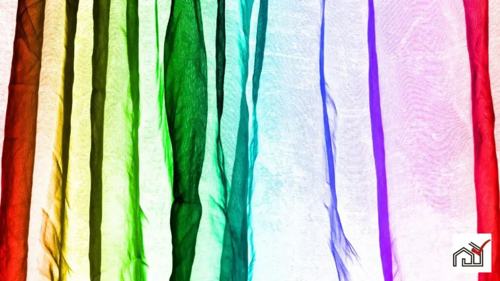 Rainbow colored voile curtains on a window