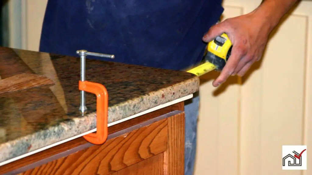 Man repairing granite countertop